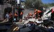Civil defense teams inspect damage following an Israeli airstrike on the Jabalia refugee c...