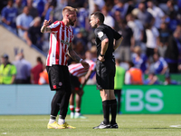 Pontus Jansson of Brentford interacts with Match referee, Jarred Gillett at the final whistle during the Premier League match between Leices...