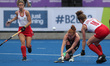 Sarah JONES of Wales in action with Natalie SOURISSEAU of Canada during the Women's Hockey...
