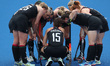 Wales discuss their next play during the Women's Hockey Pool A match between Canada and Wa...