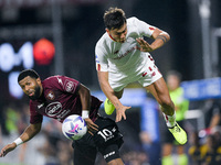 Tonny Vilhena of US Salernitana 1919 and Paulo Dybala of AS Roma compete for the ball during the Serie A match between US Salernitana 1919 a...