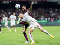 Nicolo' Zaniolo of AS Roma and Dylan Bronn of US Salernitana 1919 compete for the ball during the Serie A match between US Salernitana 1919...