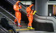 Members of Polish rescue services (fire brigade and army) wearing protective suits and gas...