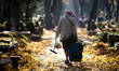 Woman at the Powazki cemetery, preparing for the day of all saints in Warsaw, Poland on Oc...