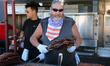 Barbecuer cooks racks of ribs during the Northern Heat Rib and Beer Festival in Richmond H...