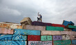 A Palestinian youth takes a selfie during a windy day  on a big stone wall on Oct. 25, 201...