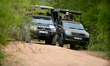 Safari jeeps wait for a leopard at Yala National park, about 250 kilometers (156 miles) so...