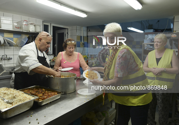 Volunteers from all over the world help at the Aspa Boomerang Restaurant, as the owner Michael Pastrikos, provides free meals for refugees a... by Artur Widak/NurPhoto