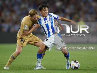 Frenkie de Jong central midfield of Barcelona and Netherlands and Takefusa Kubo Right Winger of Real Sociedad and Japan compete for the ball...