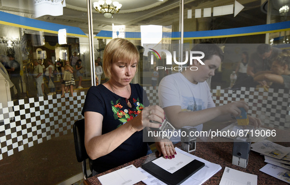 KYIV, UKRAINE - AUGUST 26, 2022 - Employees stamp the envelopes with Free. Unbreakable. Invincible. postage blocks at the Central Post Offic...