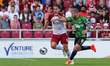 Northampton Town's Louis Appéré is challenged by Doncaster Rovers captain Adam Clayton dur...