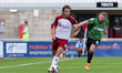 Northampton Town's Louis Appéré is challenged by Doncaster Rovers captain Adam Clayton dur...