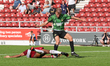 Doncaster Rovers George Miller is tackled by Northampton Town's Tyler Magloire during the...