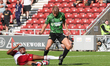 Doncaster Rovers George Miller is tackled by Northampton Town's Tyler Magloire during the...