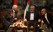 Senior Hamas leader Moussa Abu Marzouk (L) senior Fatah official Azzam Al-Ahmed (2nd L), h...