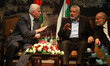 Senior Hamas leader Moussa Abu Marzouk (L) senior Fatah official Azzam Al-Ahmed (2nd L), h...