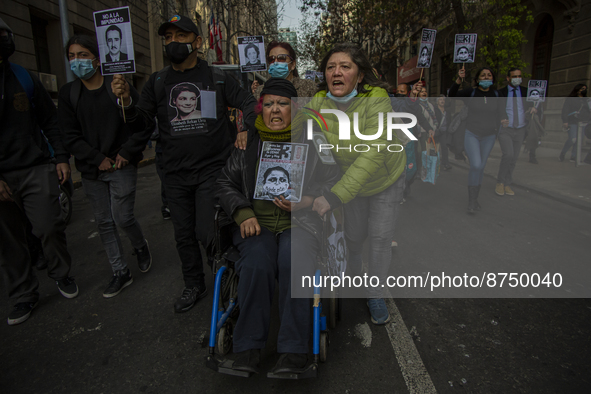 Relatives of detainees disappeared during the civil-military dictatorship of Pinochet, participate in a commemoration for the international...