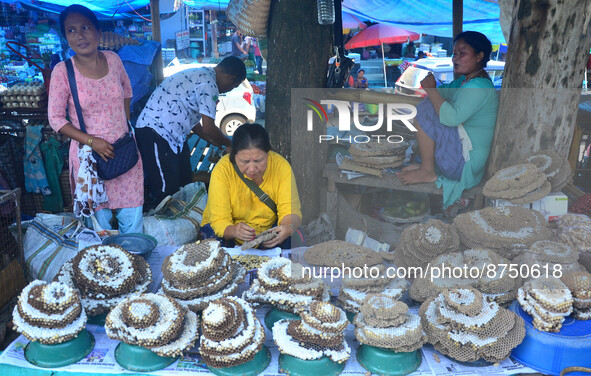 Naga Women vendor sales Bee Larva, a delicacy food for the Nagas, at a daily market in Dimapur, India north eastern state of Nagaland on Wed...
