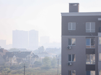 The construction sites of Kyiv outskirts are seen through the smoke from outside the city, in Kyiv, Ukraine, September 2, 2022.Kyiv was shro...