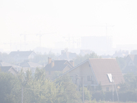 The construction sites of Kyiv outskirts are seen through the smoke from outside the city, in Kyiv, Ukraine, September 2, 2022. Kyiv was shr...