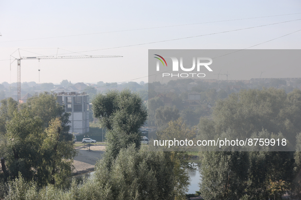 The construction sites of Kyiv outskirts are seen through the smoke from outside the city, in Kyiv, Ukraine, September 2, 2022. Kyiv was shr...
