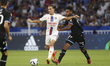 Maxence CAQUERET of Lyon and Rayan RAVELOSON of Auxerre during the French championship Lig...