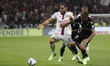 Rayan CHERKI of Lyon and Mathias AUTRET of Auxerre during the French championship Ligue 1...
