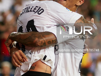 Samu Castillejo (L) of Valencia CF celebrates after scoring their side's third goal with his teammate Marcos Andre during the LaLiga Santand...
