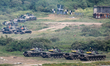 Tanks and armored vehicles are deployed during the 2-day live-fire drill, amid intensifyin...