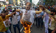 Activist are seen burning an effigy of Amit Shah during a protest rally in Kolkata , India...