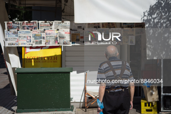 A man is looking newspapers on a kiosk in the center of Athens, Greece on September 14, 2022. 