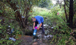 IZIUM, UKRAINE - SEPTEMBER 15, 2022 - A local resident draws water from a spring in Izium...