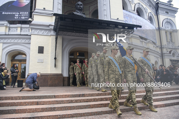 Relatives, friends and brothers-in-arms attend a funeral ceremony for volunteer soldier Oleksandr Shapoval, a famous ballet dancer and soloi...