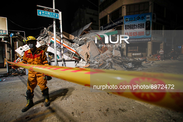 A Rescuer outside the wreckage of a collapsed residential building after a magnitude 6.8 earthquake strikes Taiwan, in Yuli, Hualien, Taiwan...