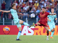 Giorgio Scalvini of Atalanta BC and Lorenzo Pellegrini of AS Roma compete for the ball during the Serie A match between AS Roma and Atalanta...