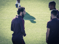 Salah, AS Roma's player, warm up during a training session, on the eve of the team's Champions League football match against Bayer Leverkuse...