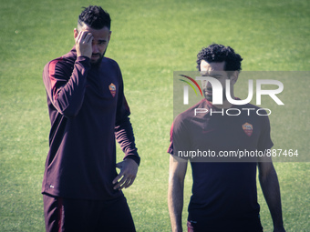 Castan (L) and Salah (R), AS Roma's players,  warm up during a training session, on the eve of the team's Champions League football match ag...