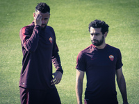Castan (L) and Salah (R), AS Roma's players,  warm up during a training session, on the eve of the team's Champions League football match ag...