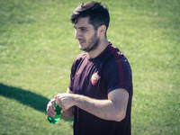 Manolas, AS Roma's player, warm up during a training session, on the eve of the team's Champions League football match against Bayer Leverku...