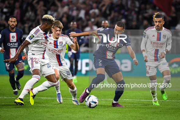 Thiago MENDES of Lyon, Johann LEPENANT of Lyon, Kylian MBAPPE of PSG and Malo GUSTO of Lyon during the French championship Ligue 1 football...