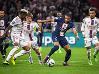 Thiago MENDES of Lyon, Johann LEPENANT of Lyon, Kylian MBAPPE of PSG and Malo GUSTO of Lyon during the French championship Ligue 1 football...