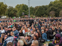 Members of the public watching the funeral broadcast of Queen Elizabeth on screen in Hyde Park on September 19, 2022, in London, England. Qu...