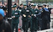 Dignitaries queue for an early morning security check before the State Funeral of Queen El...