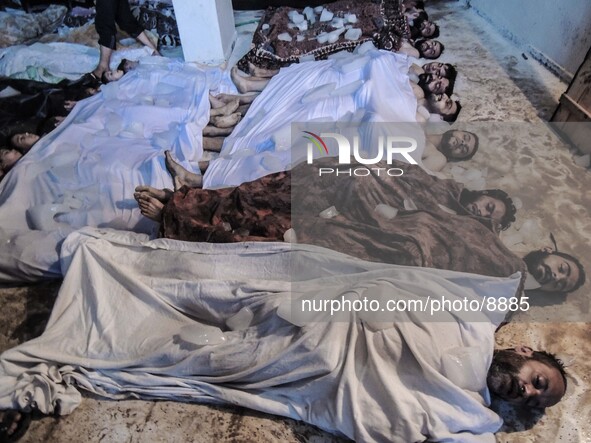 Corpses of men and children killed by nerve gas after a suspected chemical weapons attack on the Damascus suburb of Ghouta, in August 21, 20...