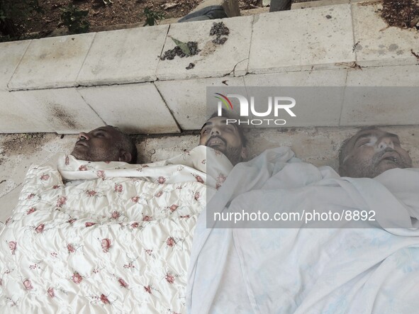 Corpses of men and children killed by nerve gas after a suspected chemical weapons attack on the Damascus suburb of Ghouta, in August 21, 20...