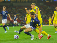 Greg Taylor of Scotland National Team with a challenge on Mykhailo Mudryk of Ukraine National Team during the UEFA Nations League match betw...
