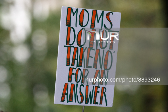 A protest sign reading 'moms do not take "no" for an answer' is seen during a rally near the U.S. Capitol in Washington, D.C. on September 2...