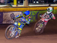 Kyle Howarth  (Blue) leads Charles Wright  (White) during the SGB Premiership match between Sheffield Tigers and Belle Vue Aces at Owlerton...