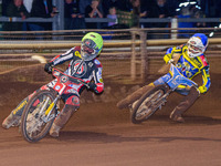 Jye Etheridge  (Yellow) leads Lewis Kerr   (Blue) during the SGB Premiership match between Sheffield Tigers and Belle Vue Aces at Owlerton S...