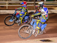 Tobiasz Musielak  (Red) and Lewis Kerr  (Blue) lead Matej Zagar (White) during the SGB Premiership match between Sheffield Tigers and Belle...